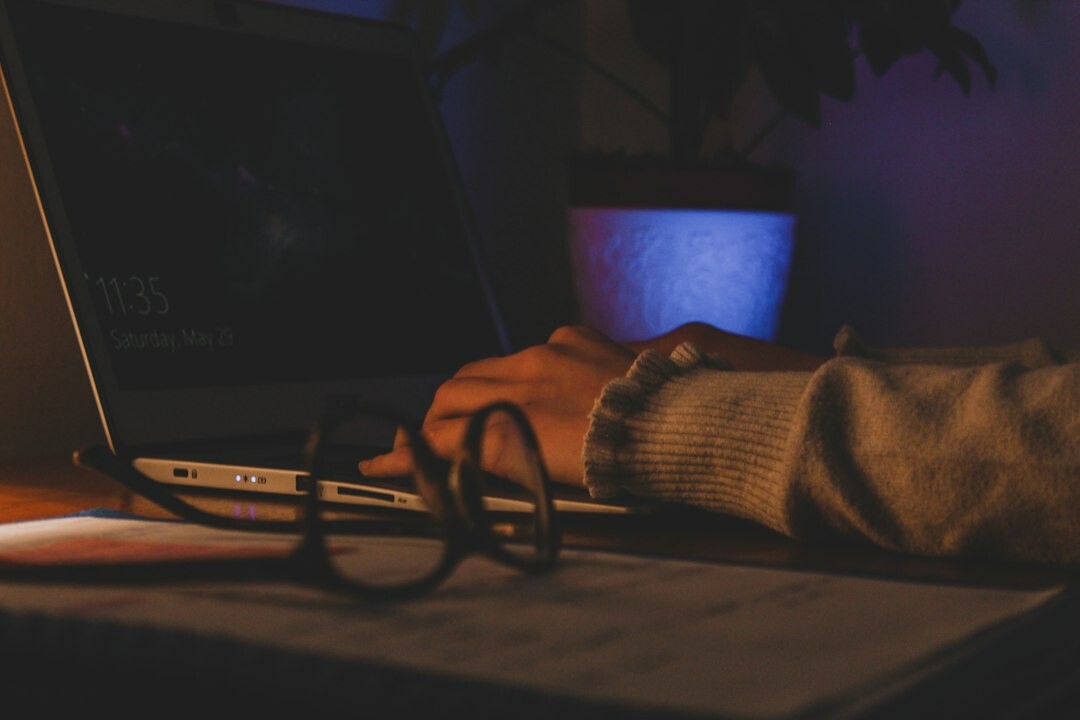writer typing at night